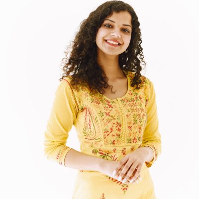 Cheerful traditional Indian woman on white background. Studio shot.